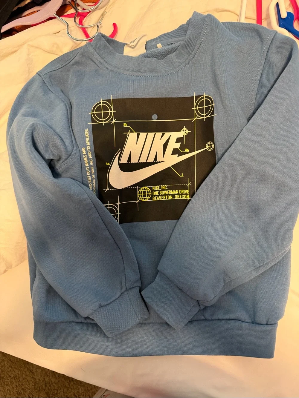 Nike Light Blue Graphic Tee with Black Swoosh